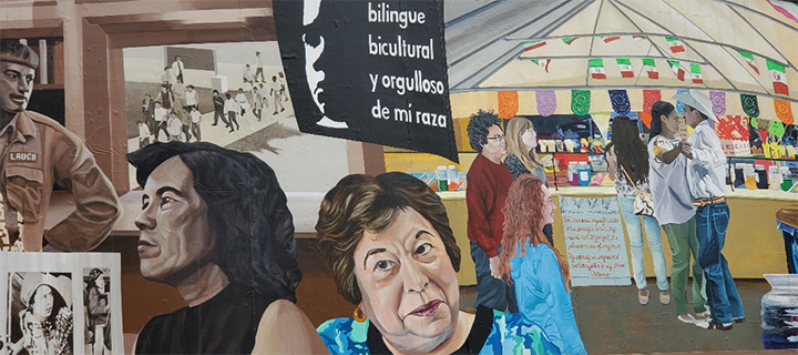Photograph of a mural with image of Graciela de La Cruz underneath a sign of Latinx pride.